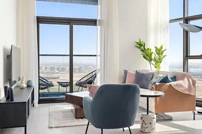 a living room with a couch and a table at Silkhaus Highfloor 1BDR in 15 Northside Tower in Dubai