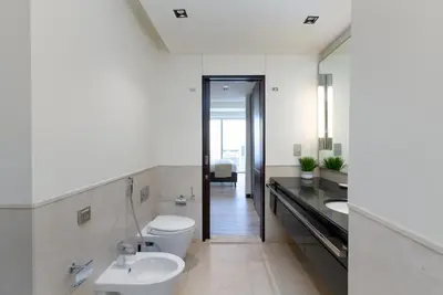 a bathroom with a white toilet and a sink at Address Dubai Marina, Dubai Marina - Mint Stay in Dubai