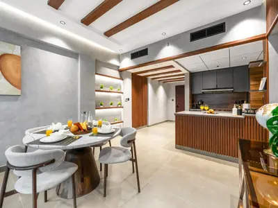 a kitchen and dining room with a table and chairs at Luxury Apartment In the Heart of Dubai Marina in Dubai