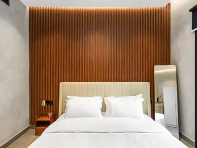 a bedroom with a large bed with white pillows at Luxury Apartment In the Heart of Dubai Marina in Dubai