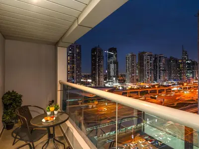a balcony with a view of a city skyline at Luxury Apartment In the Heart of Dubai Marina in Dubai