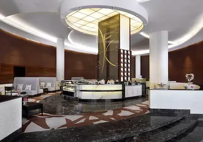 a lobby of a hotel with a lobbyasteryasteryasteryasteryasteryasteryasteryastery at Cosmos Living Studio at JW Marina in Dubai