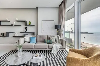 a living room with a couch and a table at GuestReady - Panoramic views from One JBR in Dubai