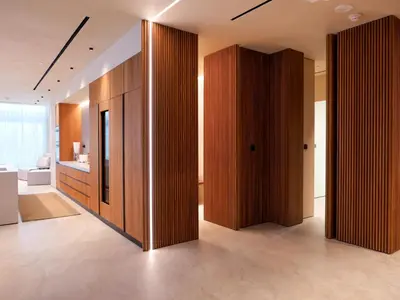 a hallway with wooden dividers in a bathroom at High End 4BR Penthouse with Private Pool and Skyline Views in Dubai
