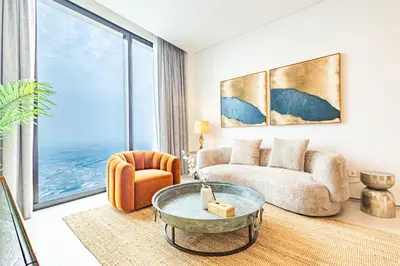 a living room with a couch and a table at High-Floor Luxury 2BR, Sea View, Address JBR in Dubai