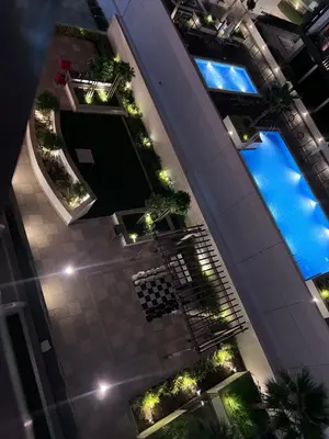 an overhead view of a building with plants and lights at Azizi riviera in Dubai