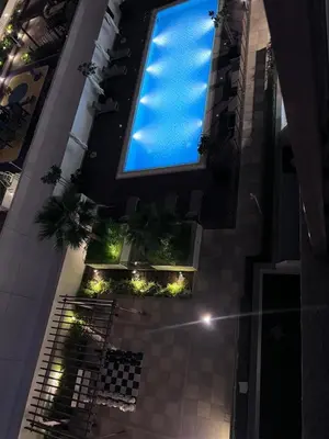 a large window in a building with a swimming pool at Azizi riviera in Dubai