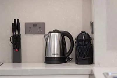 a kitchen counter with a tea kettle and a blender at Luxury 4BR Villa, Bali Pool Retreat, Ruba A Ranches 3 in Dubai