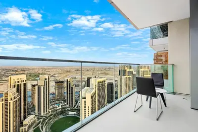 a balcony with a view of a city at Spacious Dubai Apartment with Water Views and Luxury Amenities in Dubai