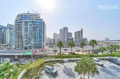 a city with cars parked in a parking lot at PRIVACASA - The Address Beach Resort residences in Dubai