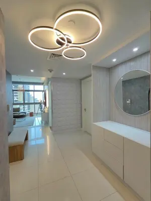 a bathroom with a ceiling fan and a mirror at Marina Bliss Luxe Stay with Waterfront and Palm Views in Dubai