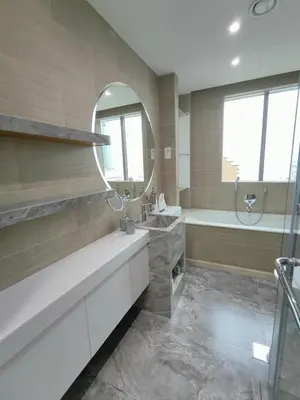 a bathroom with a tub and a sink and a mirror at Marina Bliss Luxe Stay with Waterfront and Palm Views in Dubai