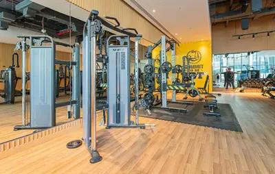 a gym with a bunch of equipment in a room at The Seven Palm with free rooftop pool & beach in Dubai