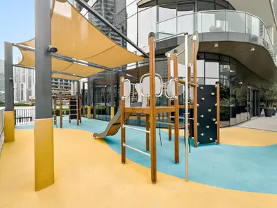 a playground in a building with a slide at Panoramic 2BR with Pool & Burj View Next to Mall in Dubai