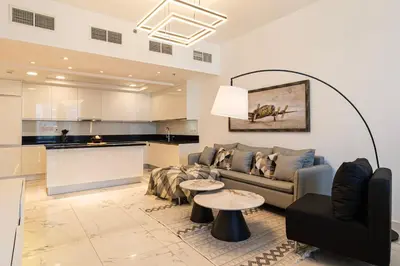 a living room with a couch and a table at 4BHK in Business Bay w Burj Khalifa View Noora 4304 in Dubai