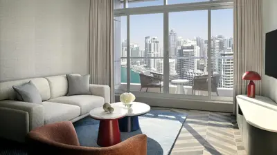 a living room with a couch and a table at InterContinental Dubai Marina by IHG in Dubai