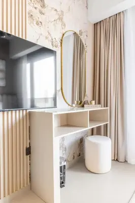 a dressing room with a mirror and a stool at Luxury 4BR with Hermes Touch & Burj Khalifa View in Dubai