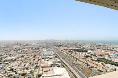 an aerial view of a city from an airplane at Silkhaus Spacious 2BR in Aykon City Near Safa Park in Dubai