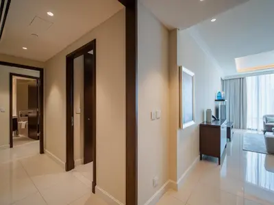 a hallway of a house with doors and a window at Address Dubai Mall Residences in Dubai