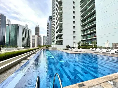 a swimming pool in the middle of a city at Burj Khalifa View Luxury Apt - 7 min to Dubai Mall in Dubai