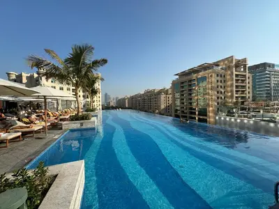 a large swimming pool on top of a building at Sea View Apartment by St Regis 5 stars Infinity Pool in Dubai