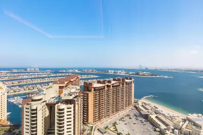 an aerial view of a city and the ocean at Sea View Apartment by St Regis 5 stars Infinity Pool in Dubai
