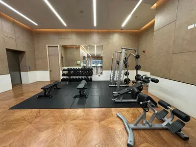 a gym with treadmills and exercise equipment in a room at Sea View Apartment by St Regis 5 stars Infinity Pool in Dubai