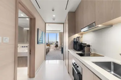a kitchen with a sink and a counter top at Sea View Apartment by St Regis 5 stars Infinity Pool in Dubai