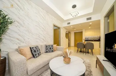 a living room with a couch and a table at Magnificent Canal View 2 Bhk 6 pax in Dubai
