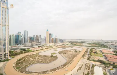 an aerial view of a city with tall buildings at Magnificent Canal View 2 Bhk 6 pax in Dubai