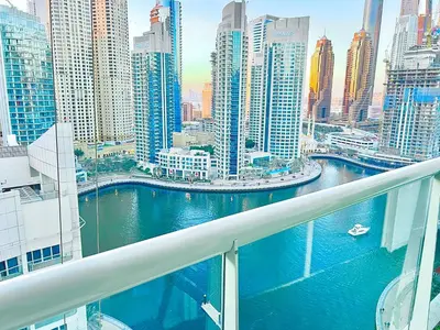 a view of a city from the balcony of a building at Stunning 2BR Marina View Apt Close to JBR in Dubai