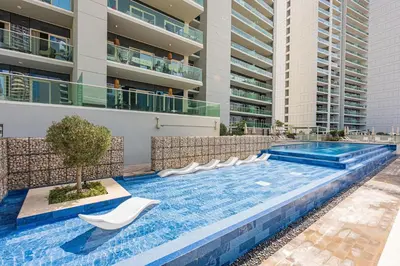 a swimming pool in the middle of a building at Apartment in Downtown Dubai in Dubai
