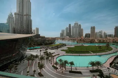 a view of a city skyline with a large pool at Gogoto1 Ultra LUX Burj View Spacious High Floor PS5 NYE Fireworks View in Dubai