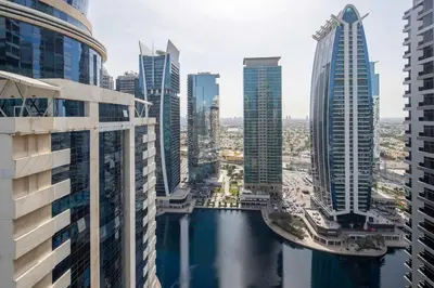 a view of a city with tall buildings at Frank Porter - Green Lakes in Dubai