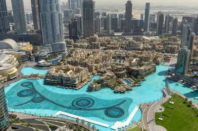 an aerial view of a city with a large pool at Maison Privee - Exclusive Apt with Unmatched Burj Khalifa Views in Dubai