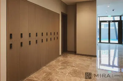 a large room with lockers in a building at Mira Holiday Homes - Bright studio with Burj Khalifa view in Business Bay in Dubai