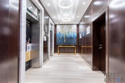 a hallway with a painting on the wall at Elegant Studio Without Balcony- Damac Hills, Dubai - Host & Stay in Dubai