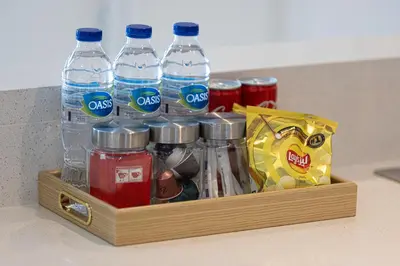 a wooden crate filled with bottles of water and snacks at Glorious Burj Khalifa and Fountain views in Dubai