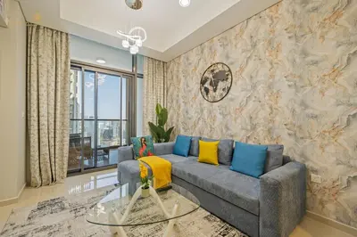 a living room with a couch and a wall with a mural at Classic Canal View 2 Bhk 6pax in Dubai