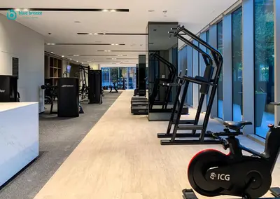 a gym with tread machines in a building at Blue Breeze - Luxury Apartment in Downtown in Dubai