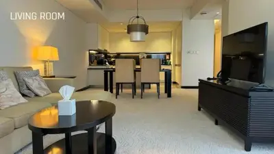 a living room with a couch and a table at JW Marriot Hotel Residence - Two bedroom Suite in Dubai
