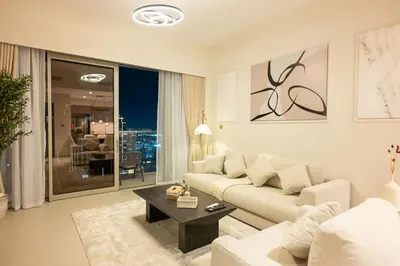 a living room with a couch and a table at 63rd High Floor - Full private Burj Khalifa and Fountain View - 2 Bedroom in Dubai