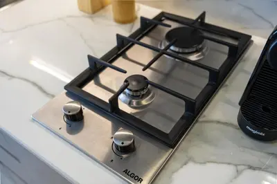 a stove top oven sitting on top of a counter at Modern Meydan Studio Near Dubai Mall & Downtown in Dubai