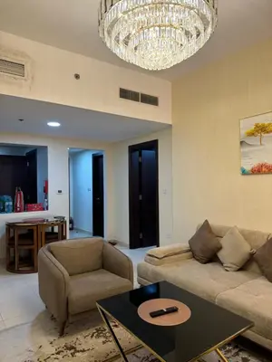 a living room with a couch and a table at Apartment in dubai in Dubai