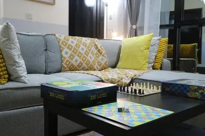 a living room with a couch and a table at Cosy 1 bed in Dubai Marina in Dubai