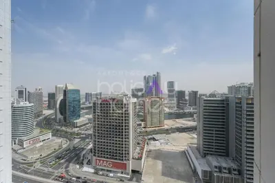 a view of a city with tall buildings and traffic at Modern 1BR in Burj Views Tower Downtown in Dubai