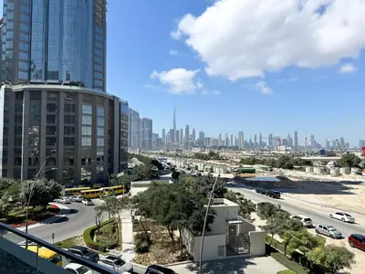 a view of a city with buildings and traffic at Trophy-Aesthetic Apartment w Skyline and Dubai in Dubai