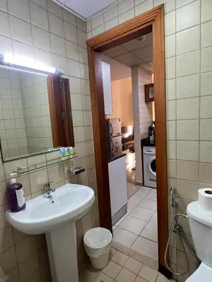 a bathroom with a sink and a toilet at MarinaBliss in Dubai