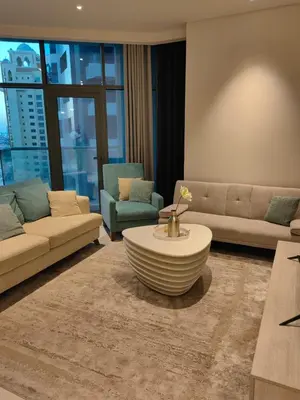 a living room with a couch and a coffee table at 7 palm Jumeirah one bedroom in Dubai