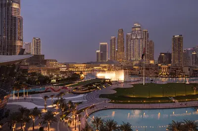 a view of a city skyline at night at Gogoto2 Lux Burj Khalifa View 5 min Dubai Mall PS5 NYE Fireworks View in Dubai